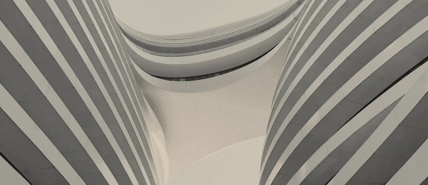 Sweeping curves of contemporary architecture in soft stone tones